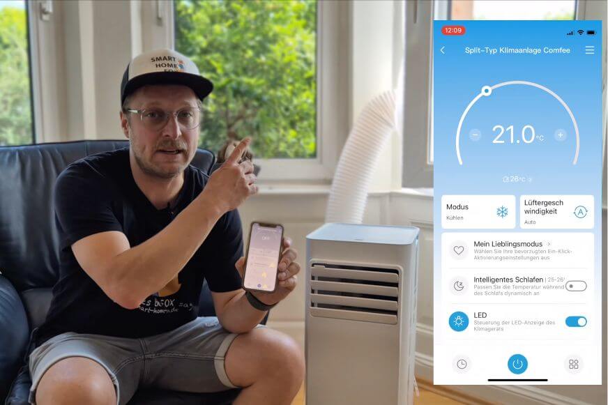 Smartphone mit geoeffneter Klimaanlagen-App neben der Comfee Breezy Cool 2.6